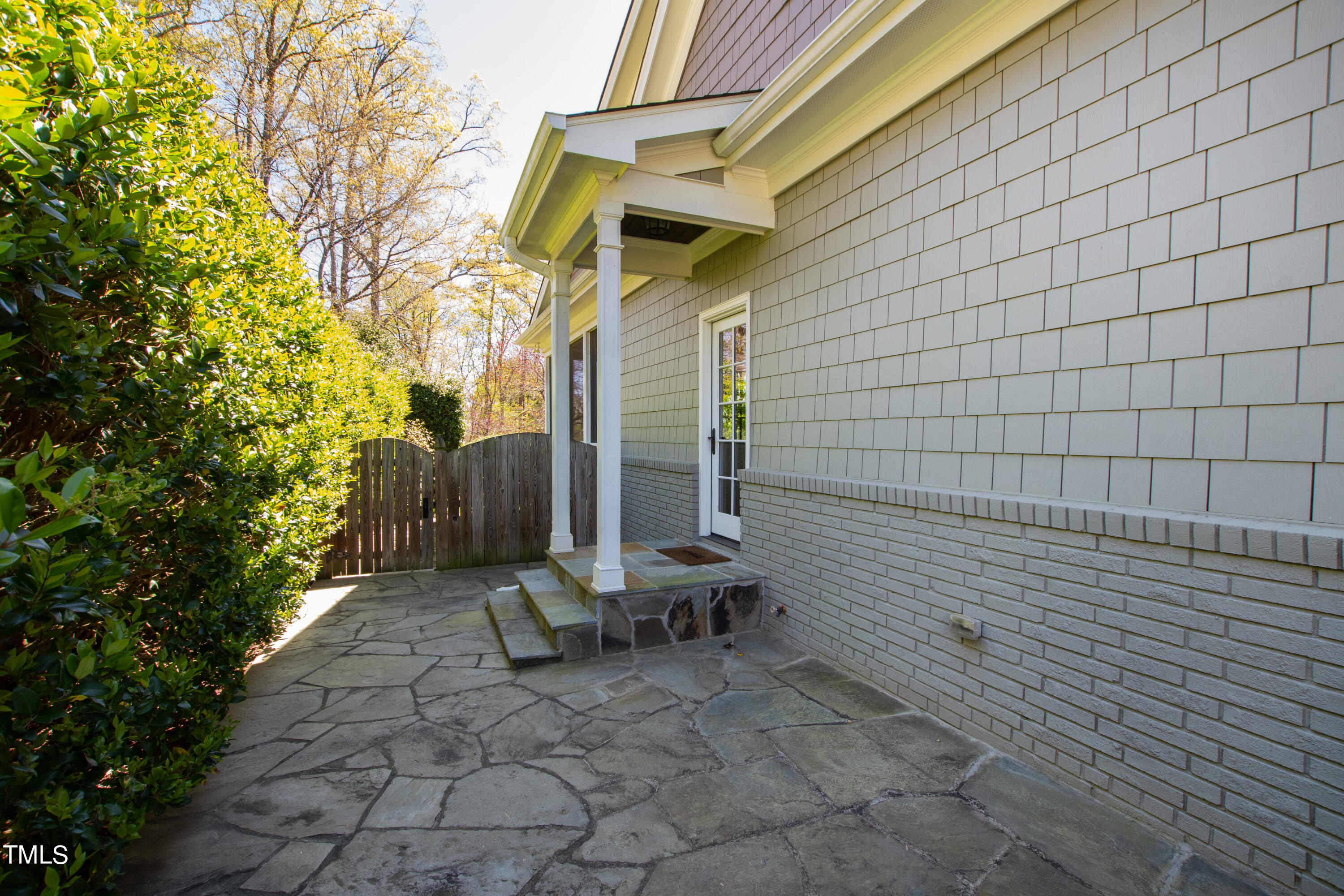 2210 Coley Forest Place Raleigh, NC 27607 - Photo 44 of 44 a view of a patio with table and chairs and potted plants