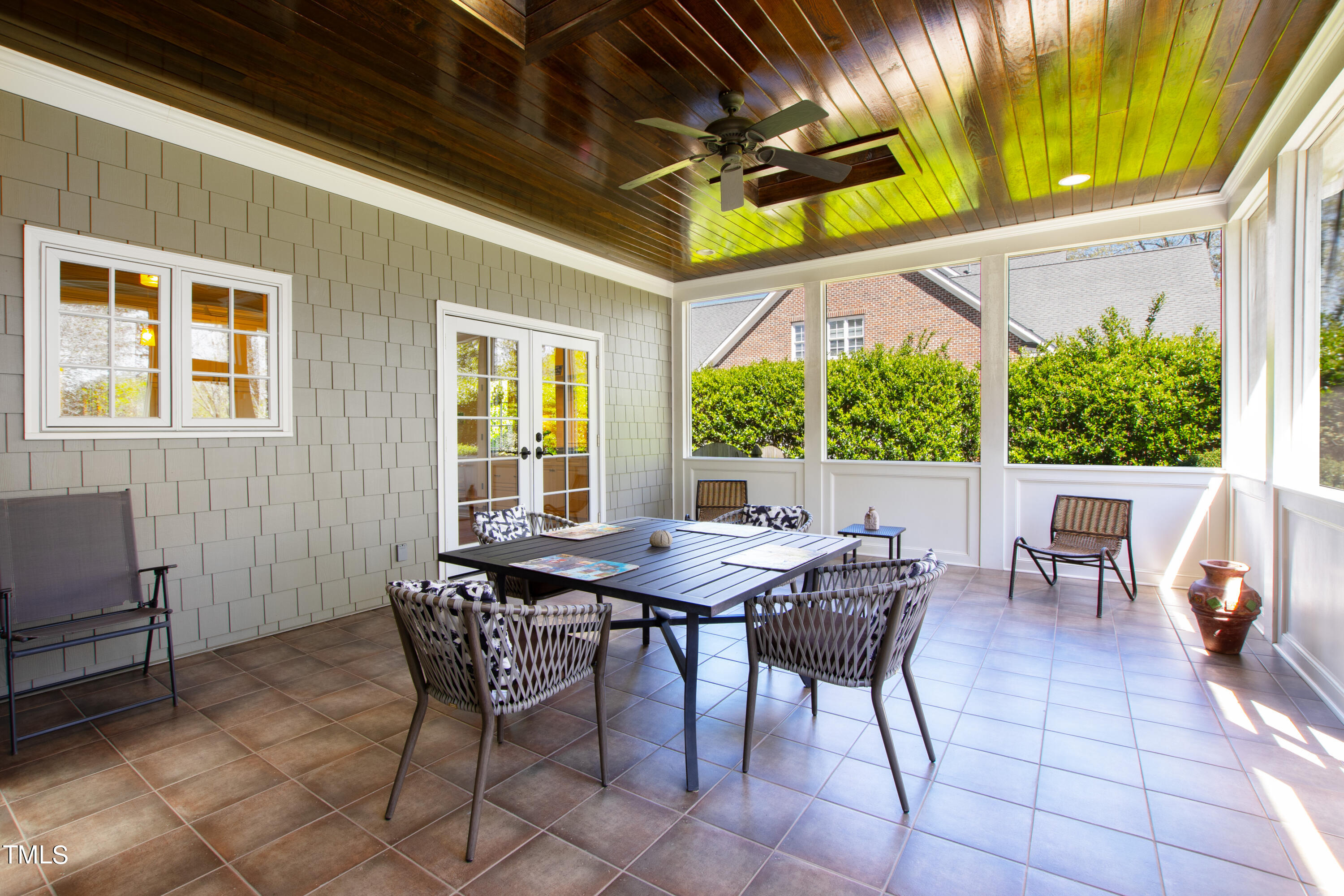2210 Coley Forest Place Raleigh, NC 27607 - Photo 5 of 44 a view of a patio with a table and chairs and potted plants