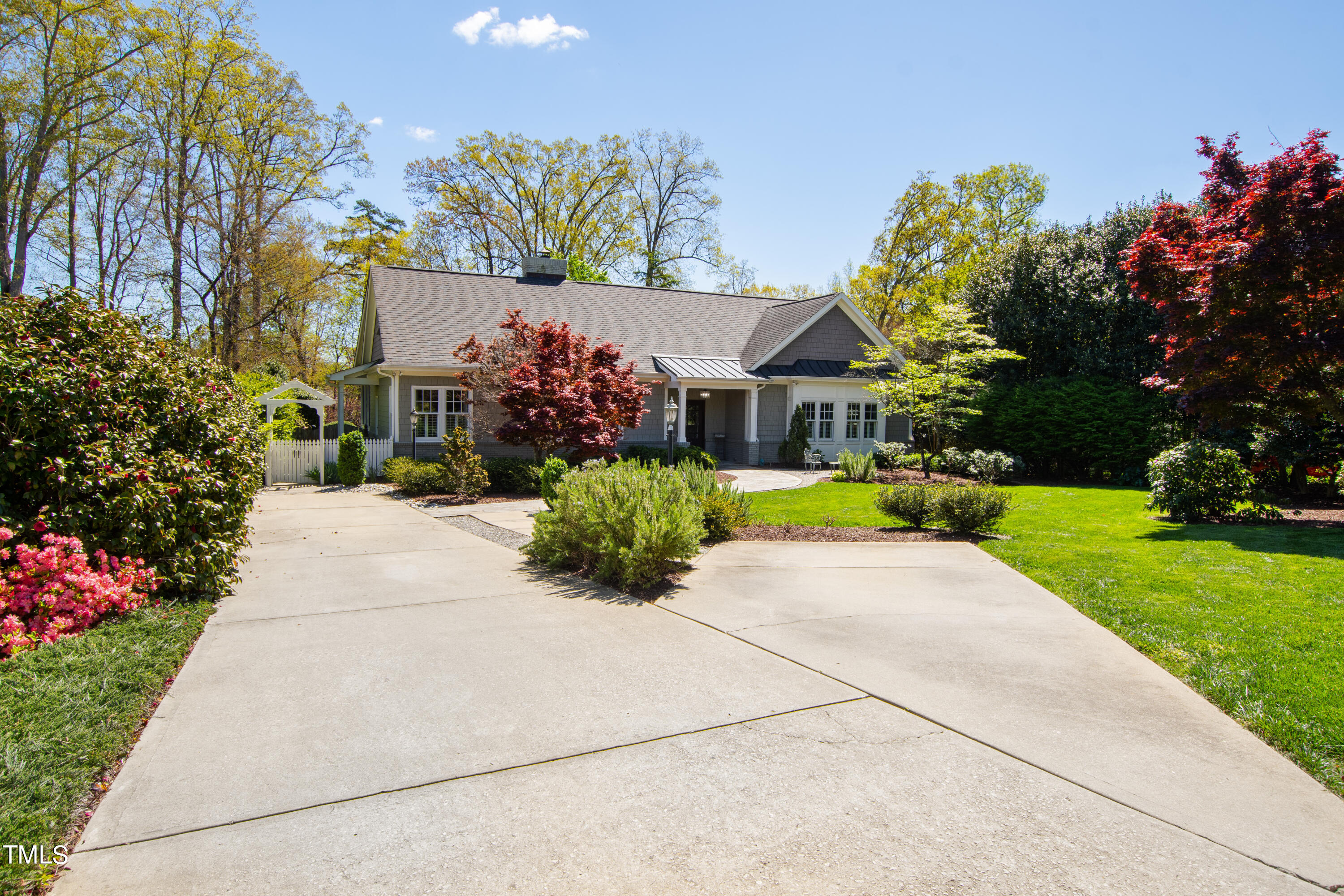 2210 Coley Forest Place Raleigh, NC 27607 - Photo 6 of 44 a front view of a house with a yard and a garage