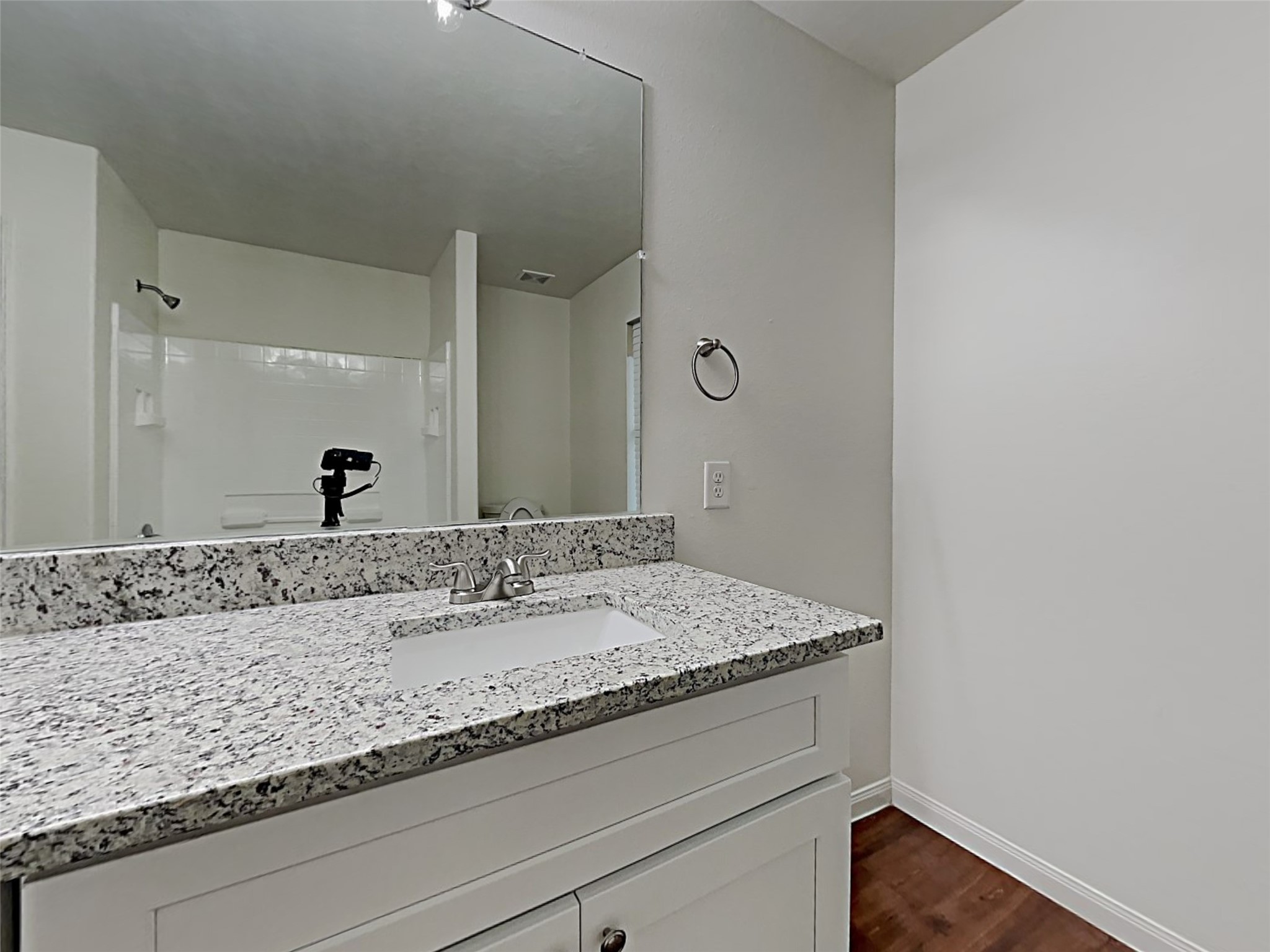 21619 Ornella Circle Humble, TX 77338 - Photo 12 of 18 a bathroom with a granite countertop sink and a mirror
