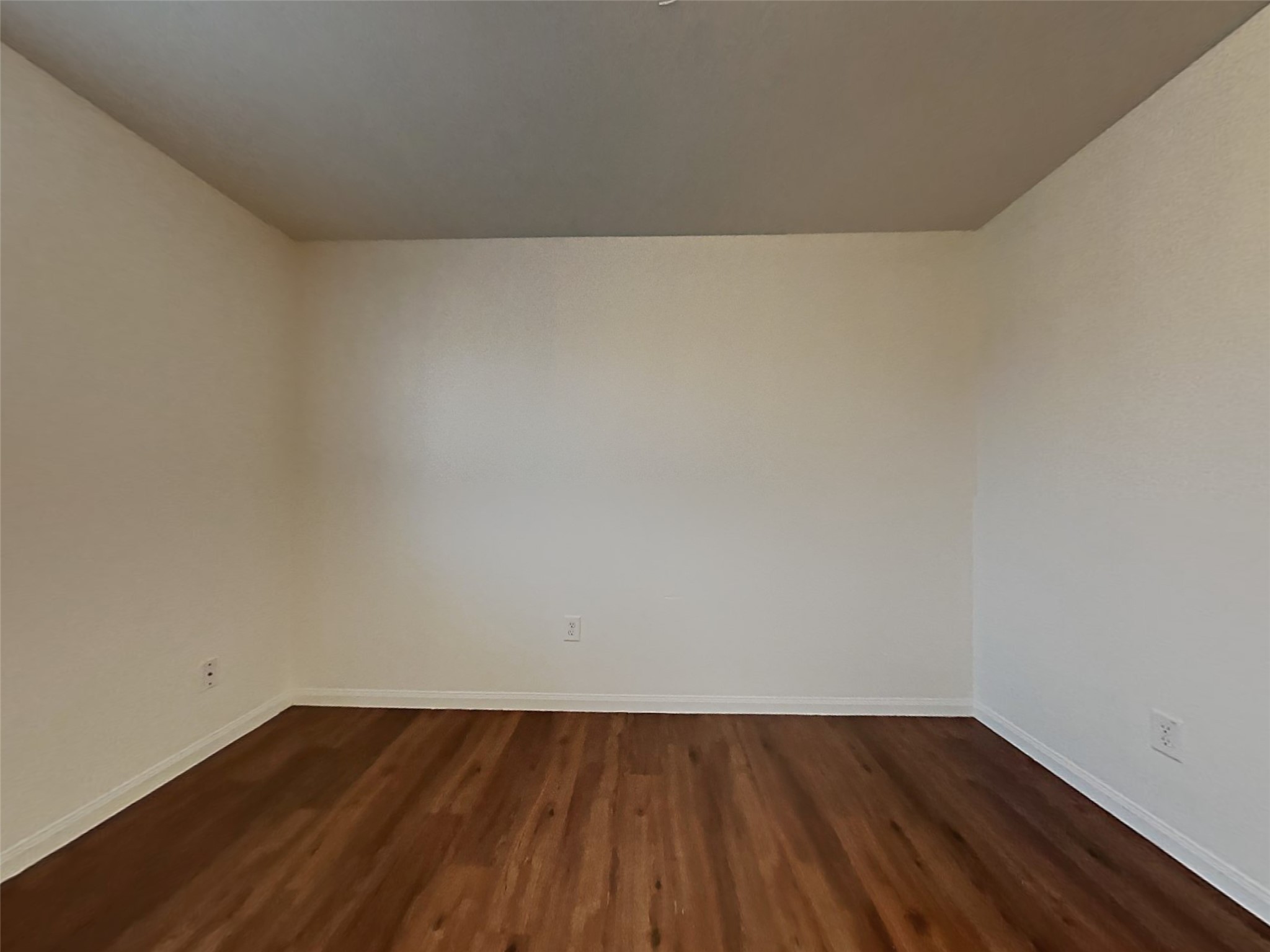 21619 Ornella Circle Humble, TX 77338 - Photo 13 of 18 a view of an empty room and wooden floor