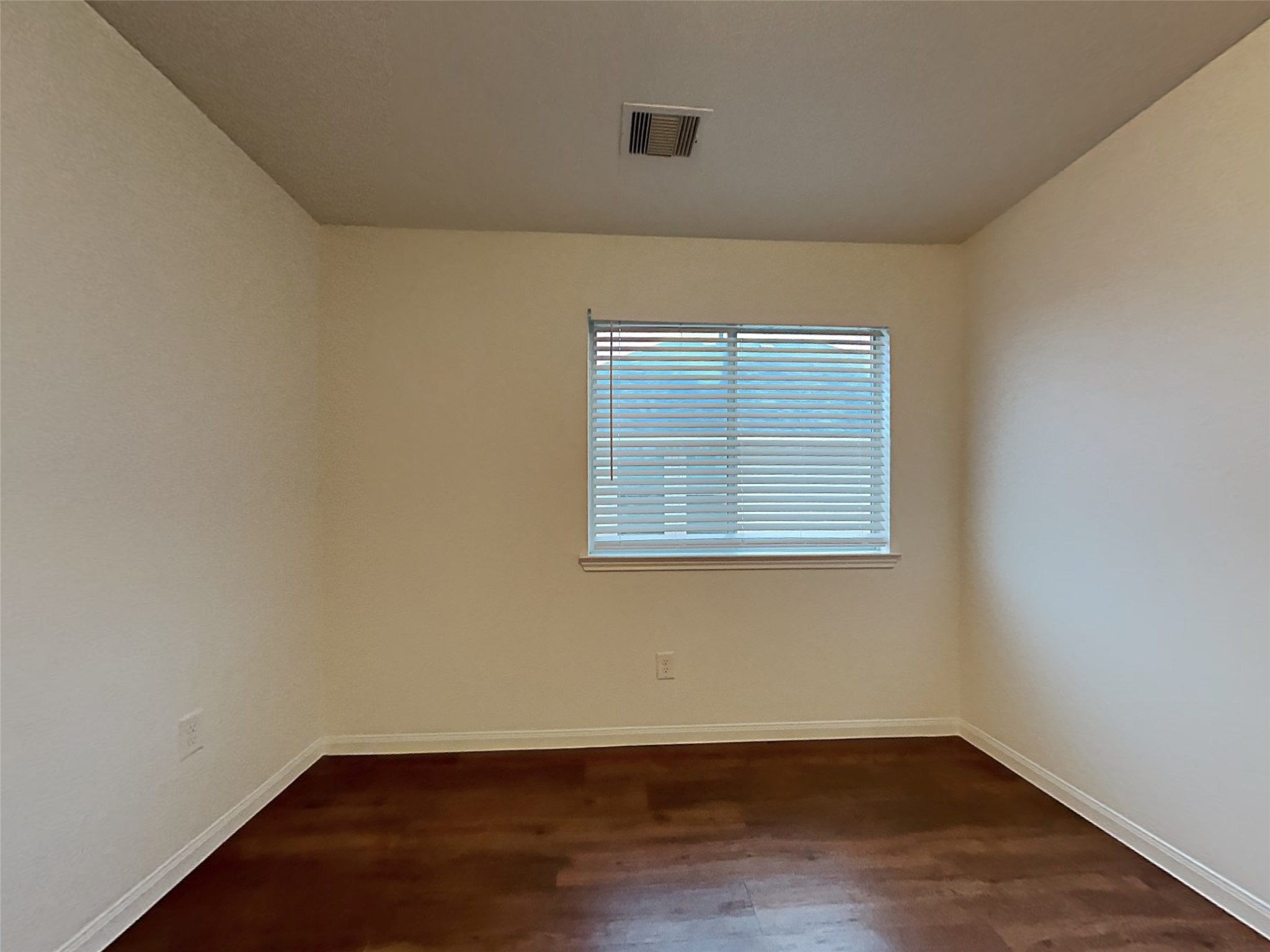 21619 Ornella Circle Humble, TX 77338 - Photo 15 of 18 an empty room with wooden floor and windows