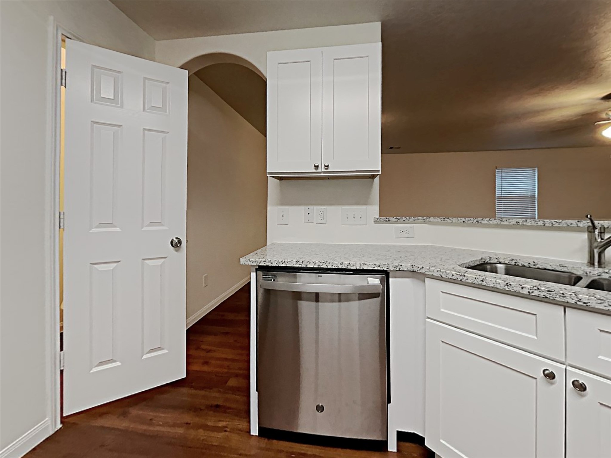 21619 Ornella Circle Humble, TX 77338 - Photo 5 of 18 a kitchen with granite countertop white cabinets and white appliances