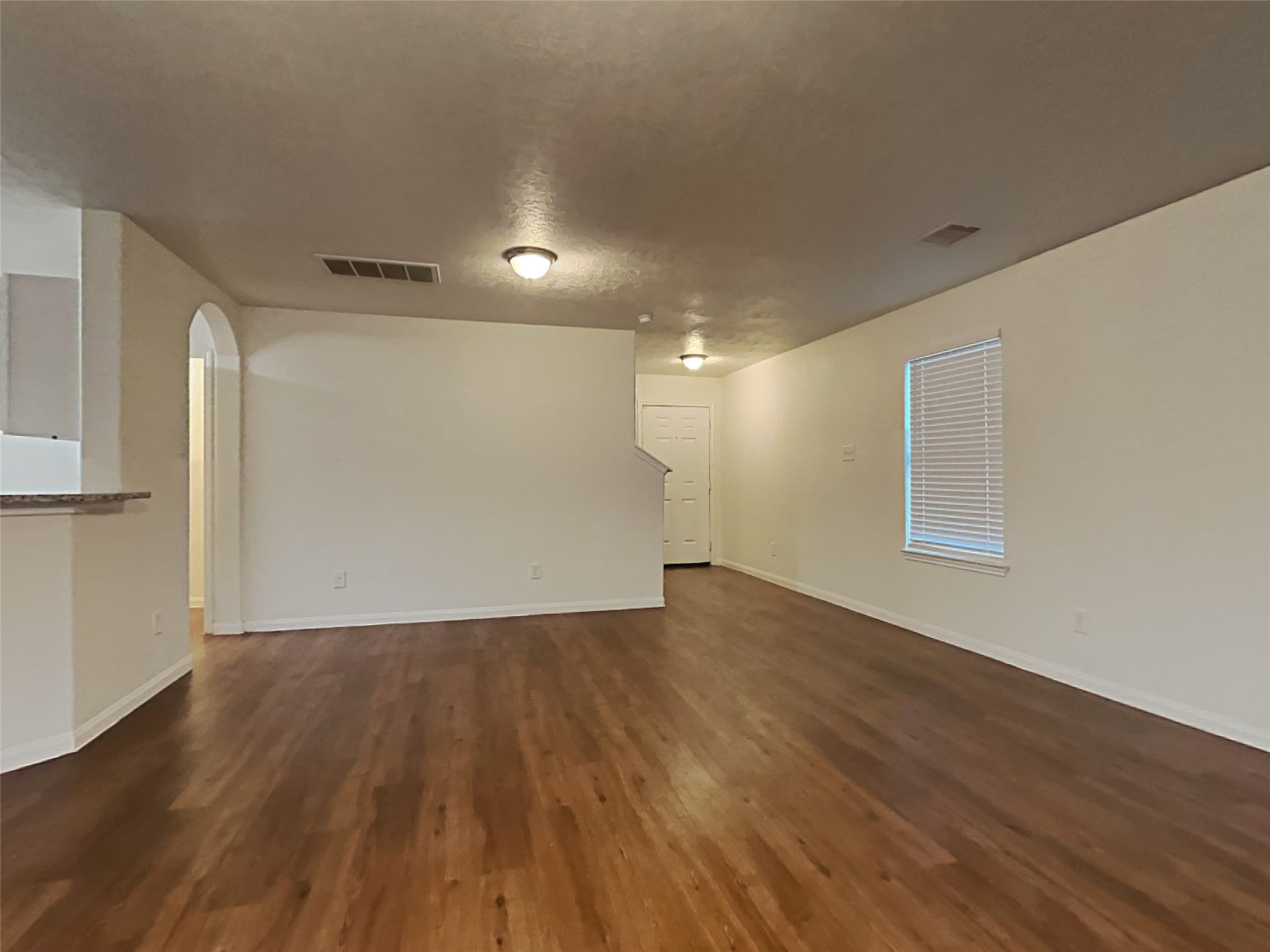 21619 Ornella Circle Humble, TX 77338 - Photo 6 of 18 a view of an empty room with wooden floor