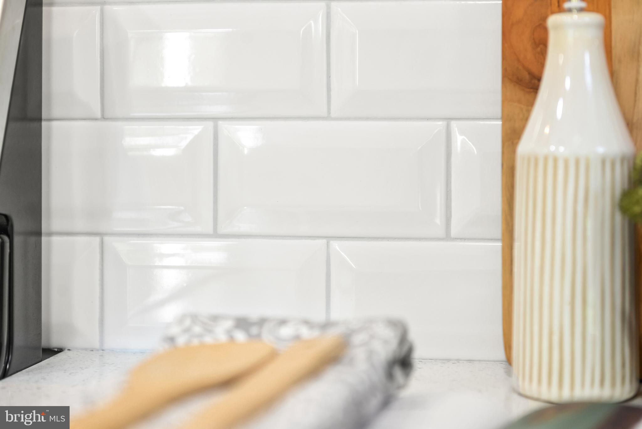 2528 Monocacy Bottom Road Adamstown, MD 21710 - Photo 21 of 61 Clean subway tile and bright white cabinetry.