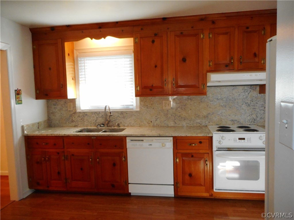 911 Jamestown Road Colonial Heights, VA 23834 - Photo 11 of 17 a kitchen with stainless steel appliances granite countertop wooden cabinets a stove and a window