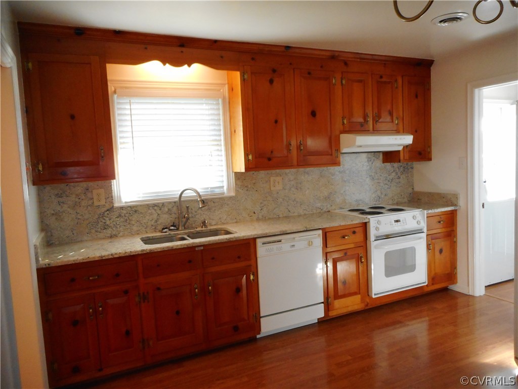 911 Jamestown Road Colonial Heights, VA 23834 - Photo 12 of 17 a kitchen with stainless steel appliances granite countertop a sink a stove and a wooden cabinets
