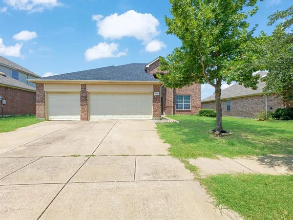 a front view of a house with yard