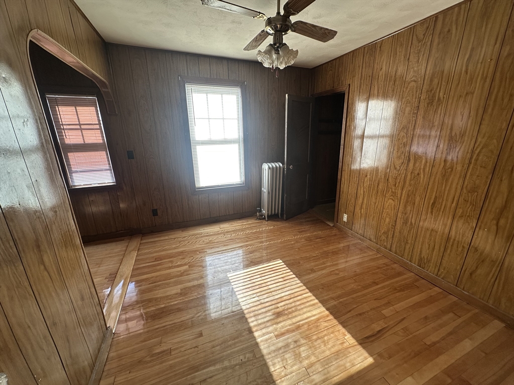 242 Greenwood Street Worcester, MA 01607 - Photo 6 of 10 a bedroom with a bed and a window