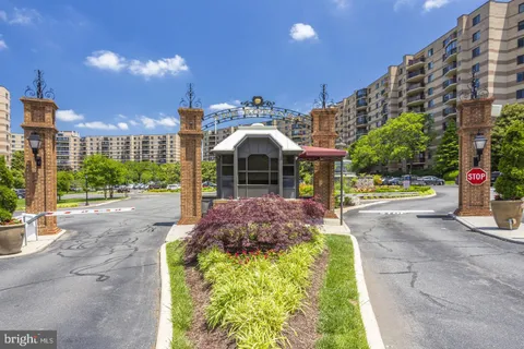 an aerial view of a swimming pool patio and outdoor seating