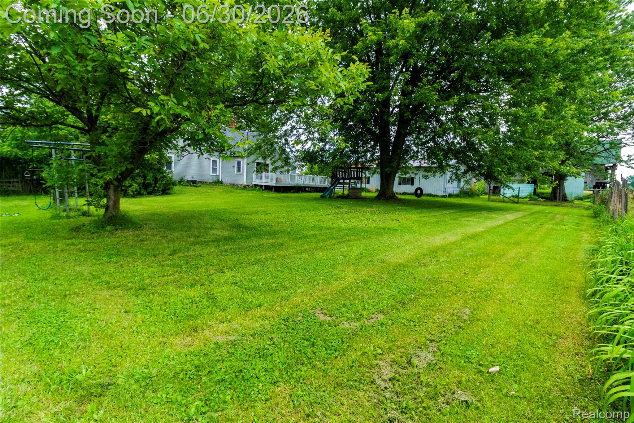 8150 Norman Road Imlay City, MI 48444 - Photo 41 of 58 Expansive green lawn featuring mature trees