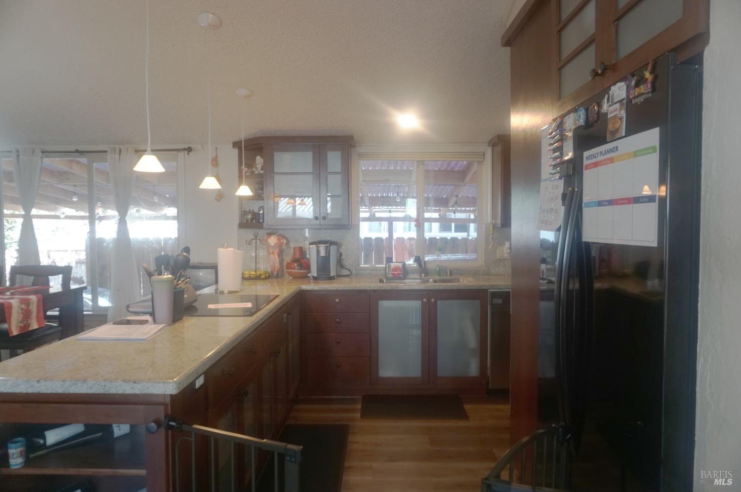 6004 Monticello Road, Unit 10 Napa, CA 94558 - Photo 14 of 41 a kitchen with stainless steel appliances granite countertop a sink and cabinets