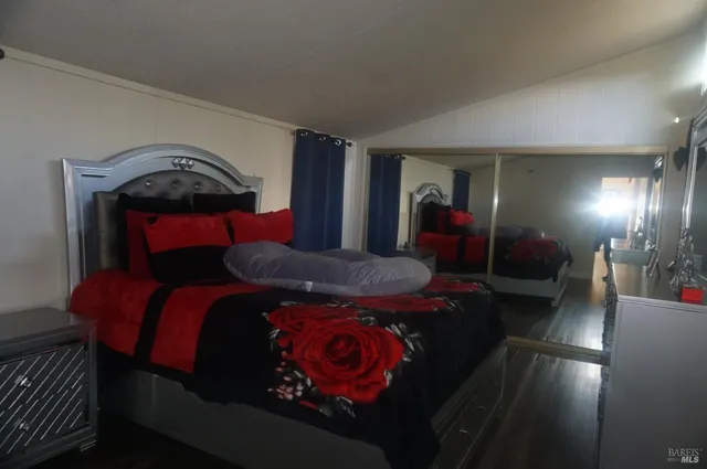 a bedroom with a bed and dresser