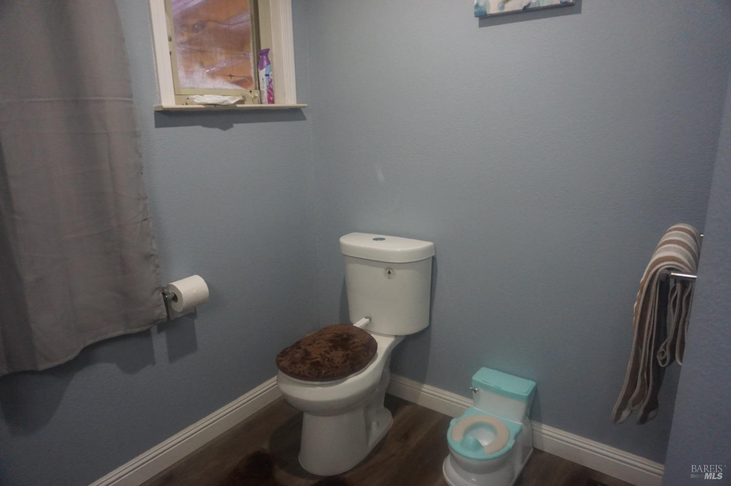 6004 Monticello Road, Unit 10 Napa, CA 94558 - Photo 36 of 41 a white toilet sitting next to a sink