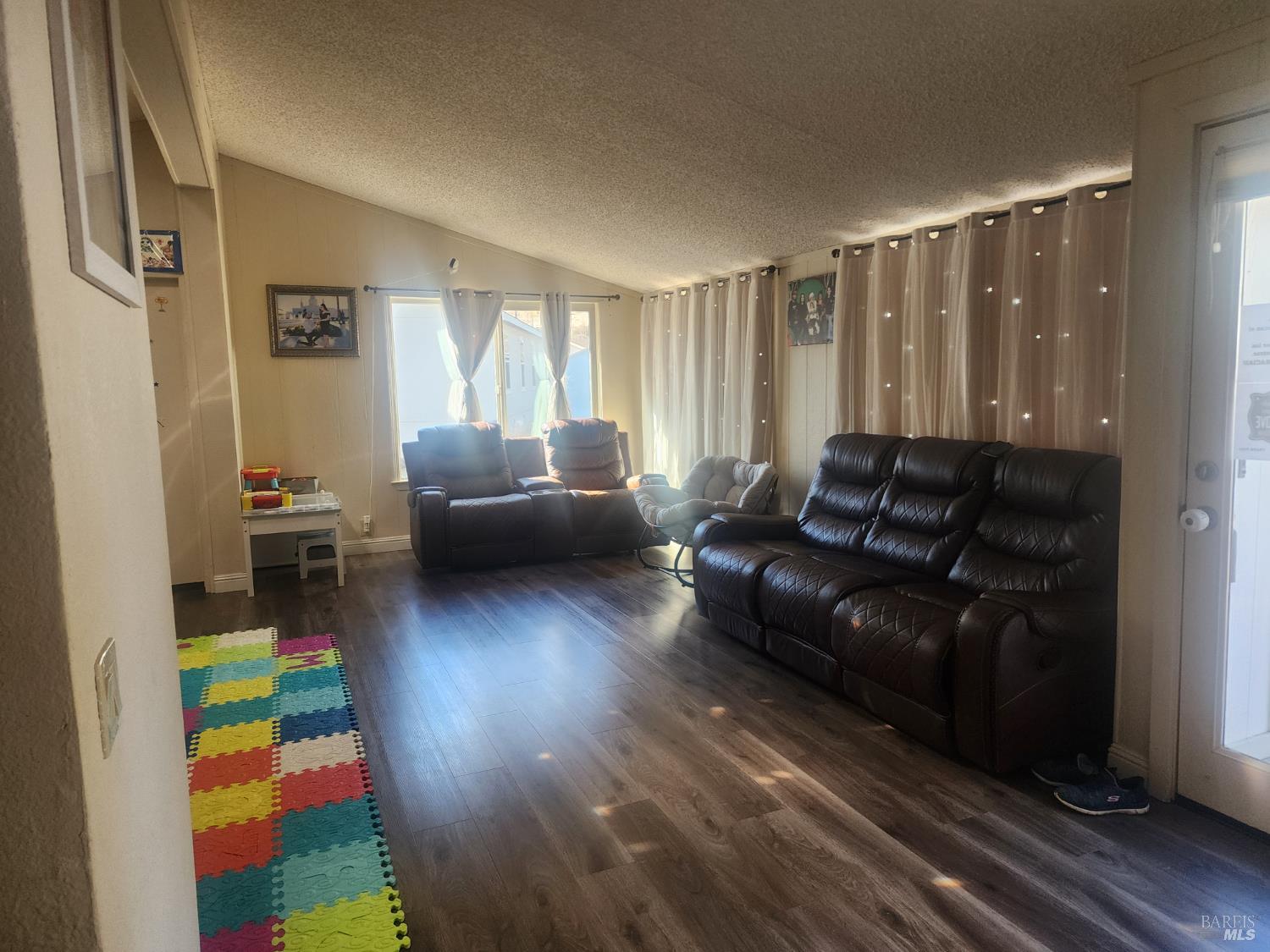 6004 Monticello Road, Unit 10 Napa, CA 94558 - Photo 5 of 41 a living room with furniture and a wooden floor