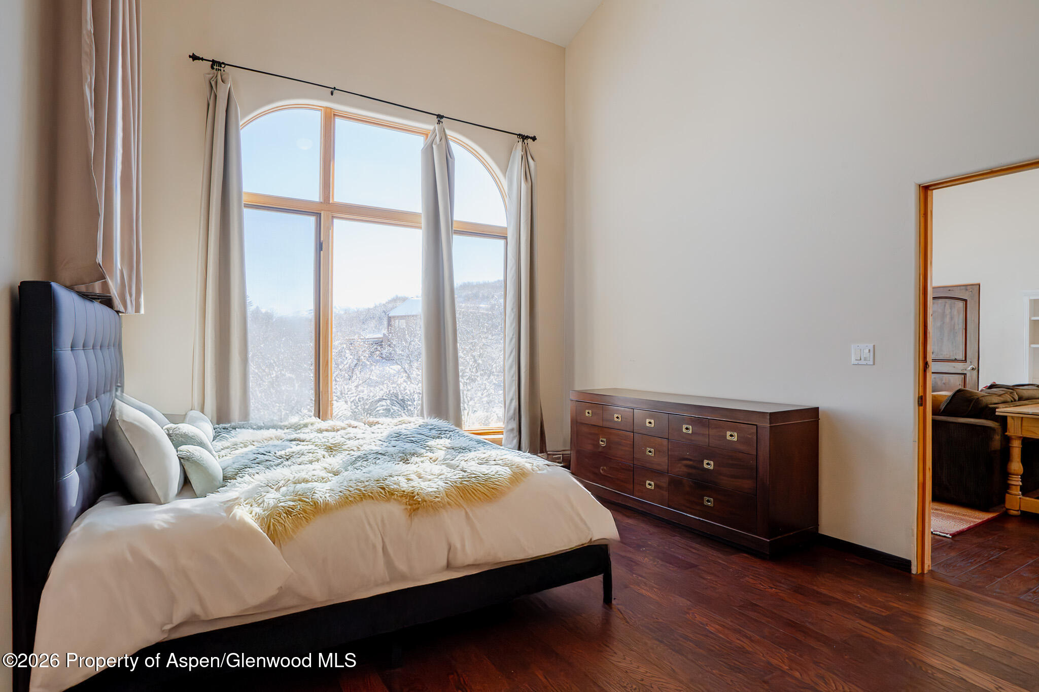 2310 Juniper Hill Road Aspen, CO 81611 - Photo 14 of 50 a bed sitting in a bedroom next to a window