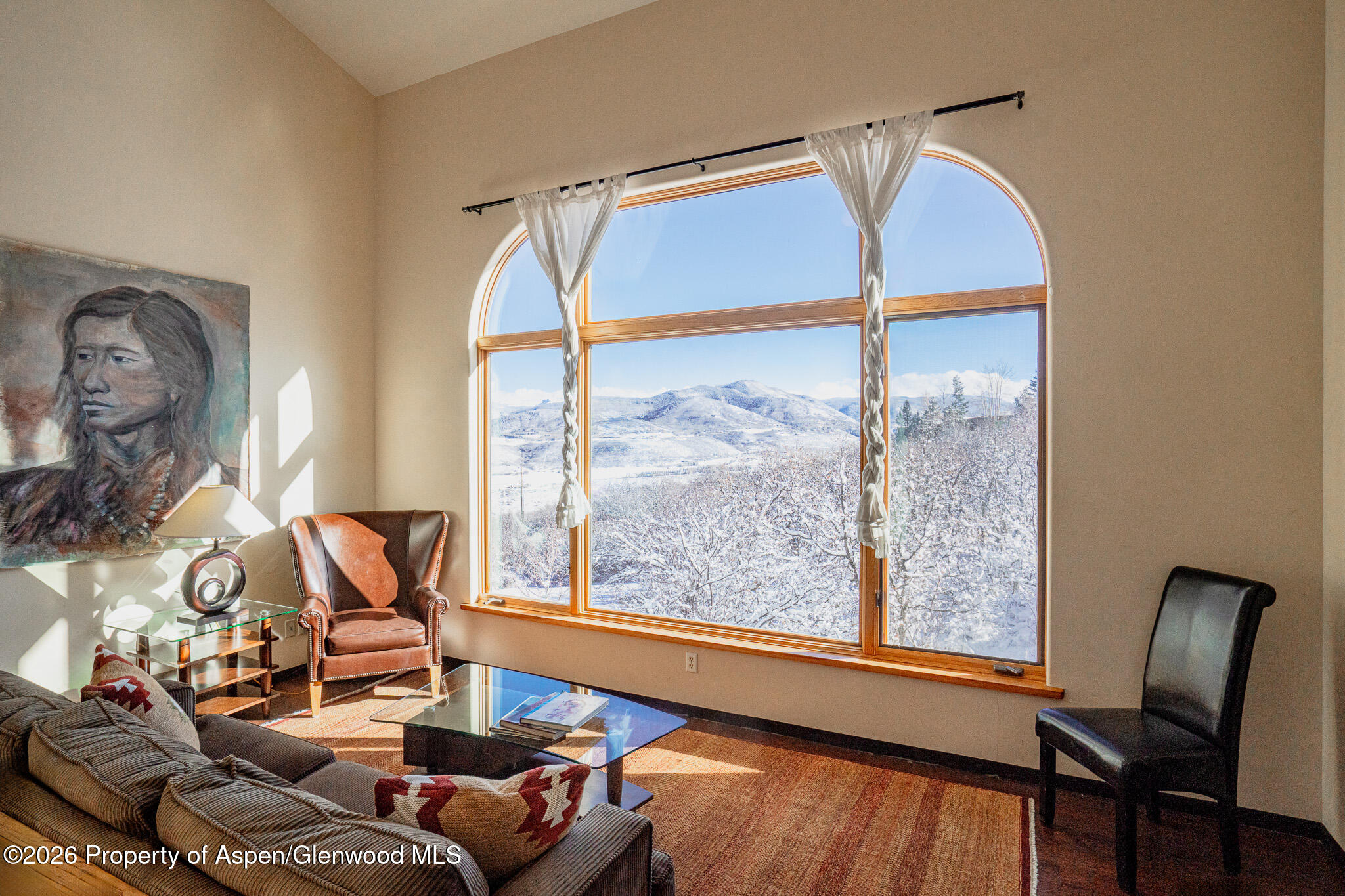 2310 Juniper Hill Road Aspen, CO 81611 - Photo 22 of 50 a living room with furniture and a large window