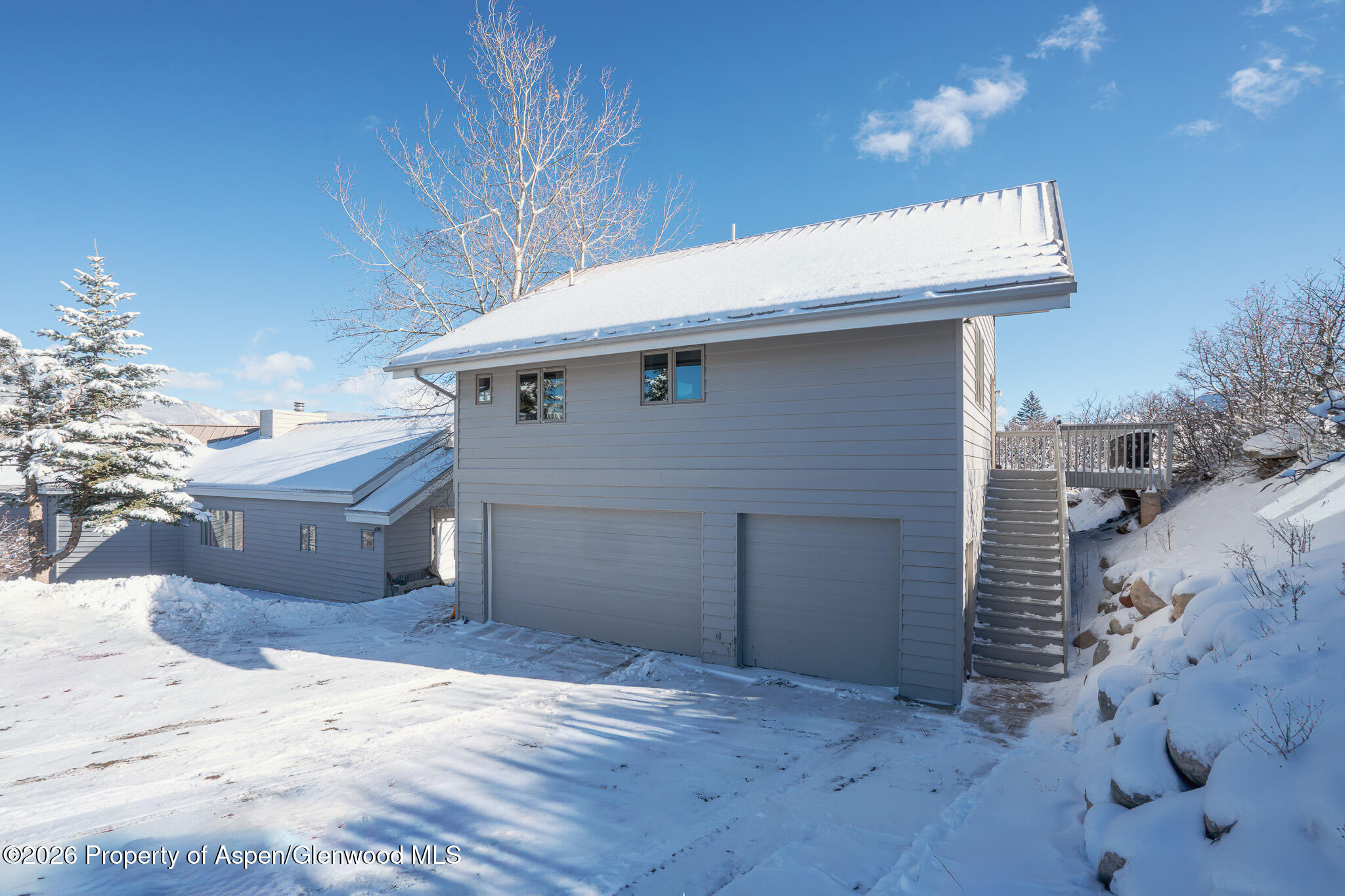 2310 Juniper Hill Road Aspen, CO 81611 - Photo 3 of 50 a view of a white house with a outdoor space