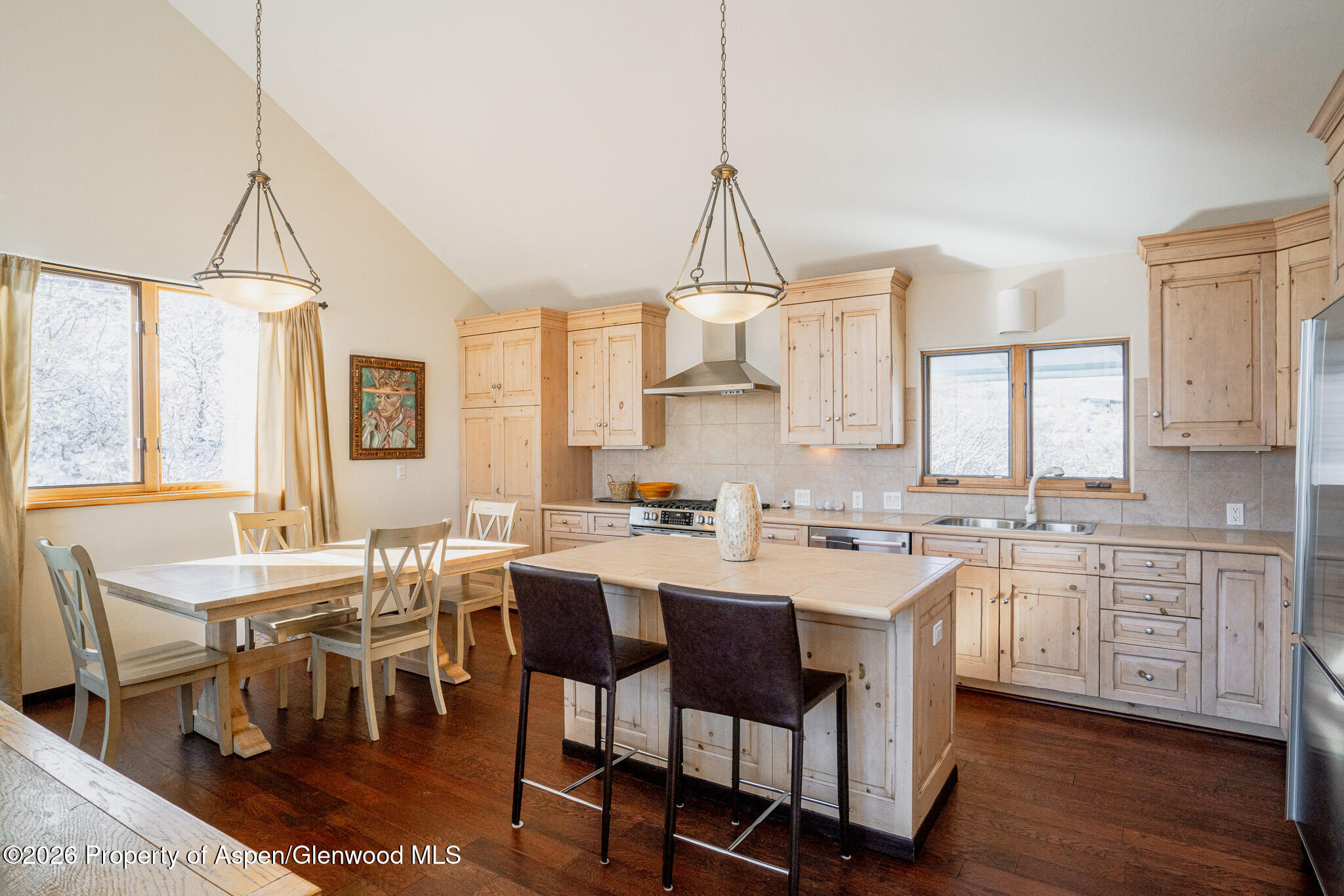 2310 Juniper Hill Road Aspen, CO 81611 - Photo 39 of 50 a view of a dining room and livingroom with furniture wooden floor a chandelier