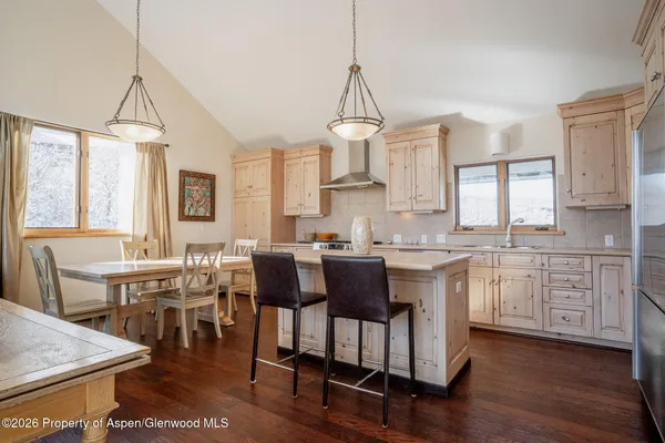 a kitchen with sink cabinets and dining table