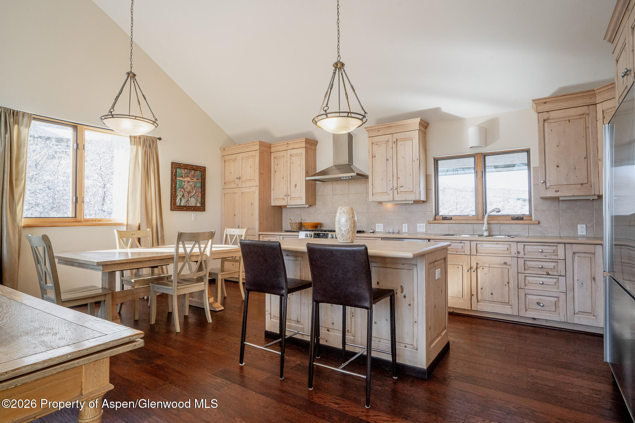 2310 Juniper Hill Road Aspen, CO 81611 - Photo 43 of 50 a kitchen with sink cabinets and dining table