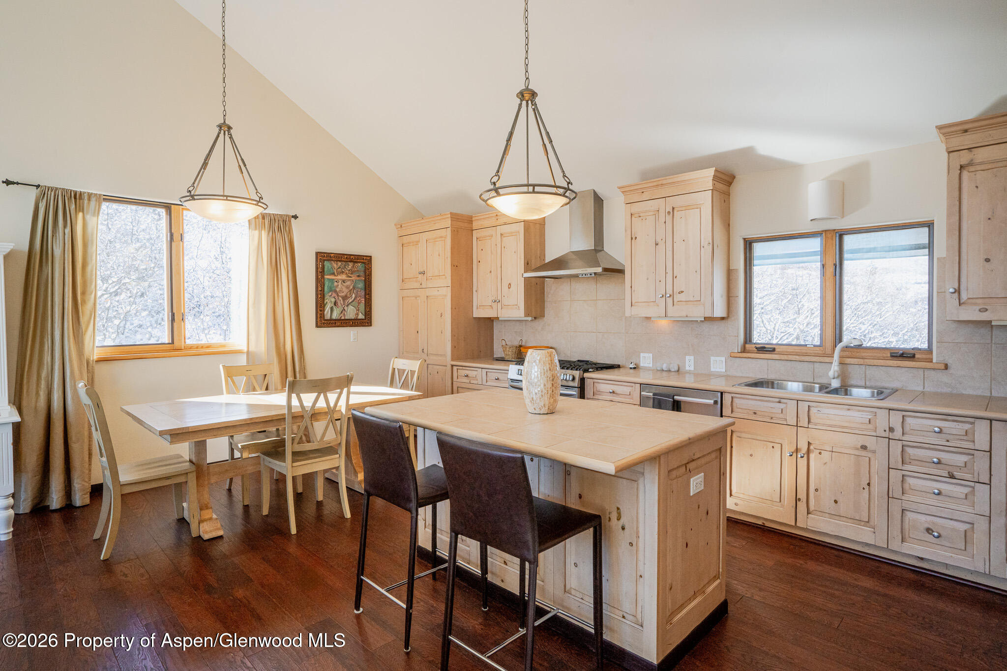 2310 Juniper Hill Road Aspen, CO 81611 - Photo 45 of 50 a kitchen with a stove a table and chairs