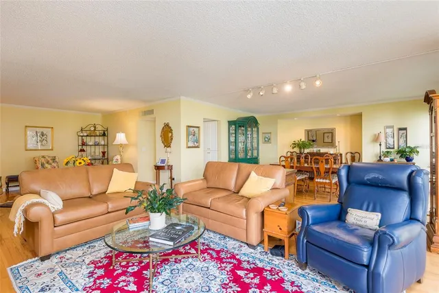 a dining room with furniture and wooden floor