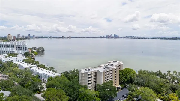 an aerial view of a city with lots of residential buildings in the background