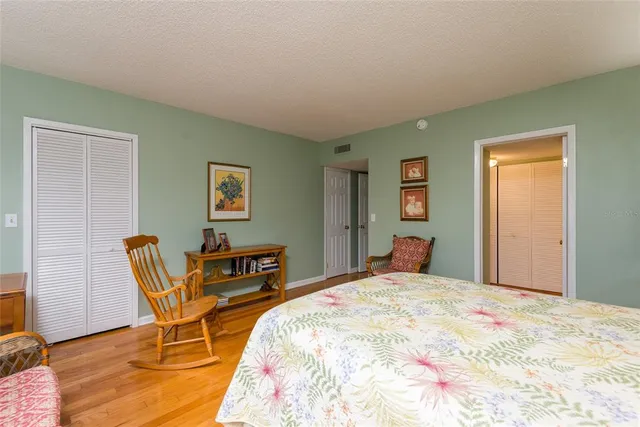 a bedroom with a bed and a closet