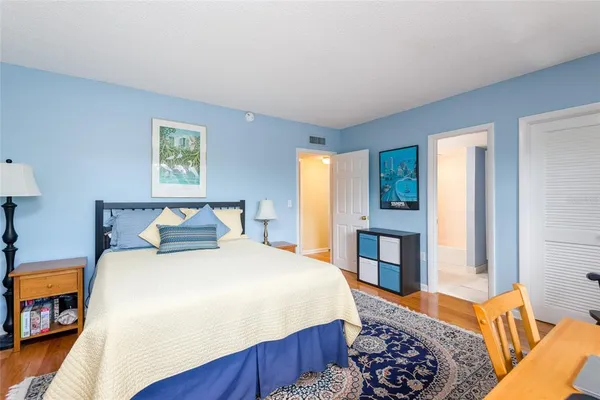 a bedroom with a bed and a closet