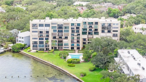 a view of a tall building with a yard