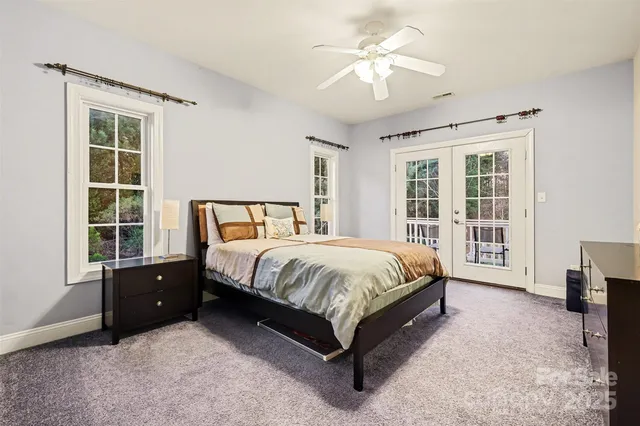 a spacious bedroom with a bed and a window