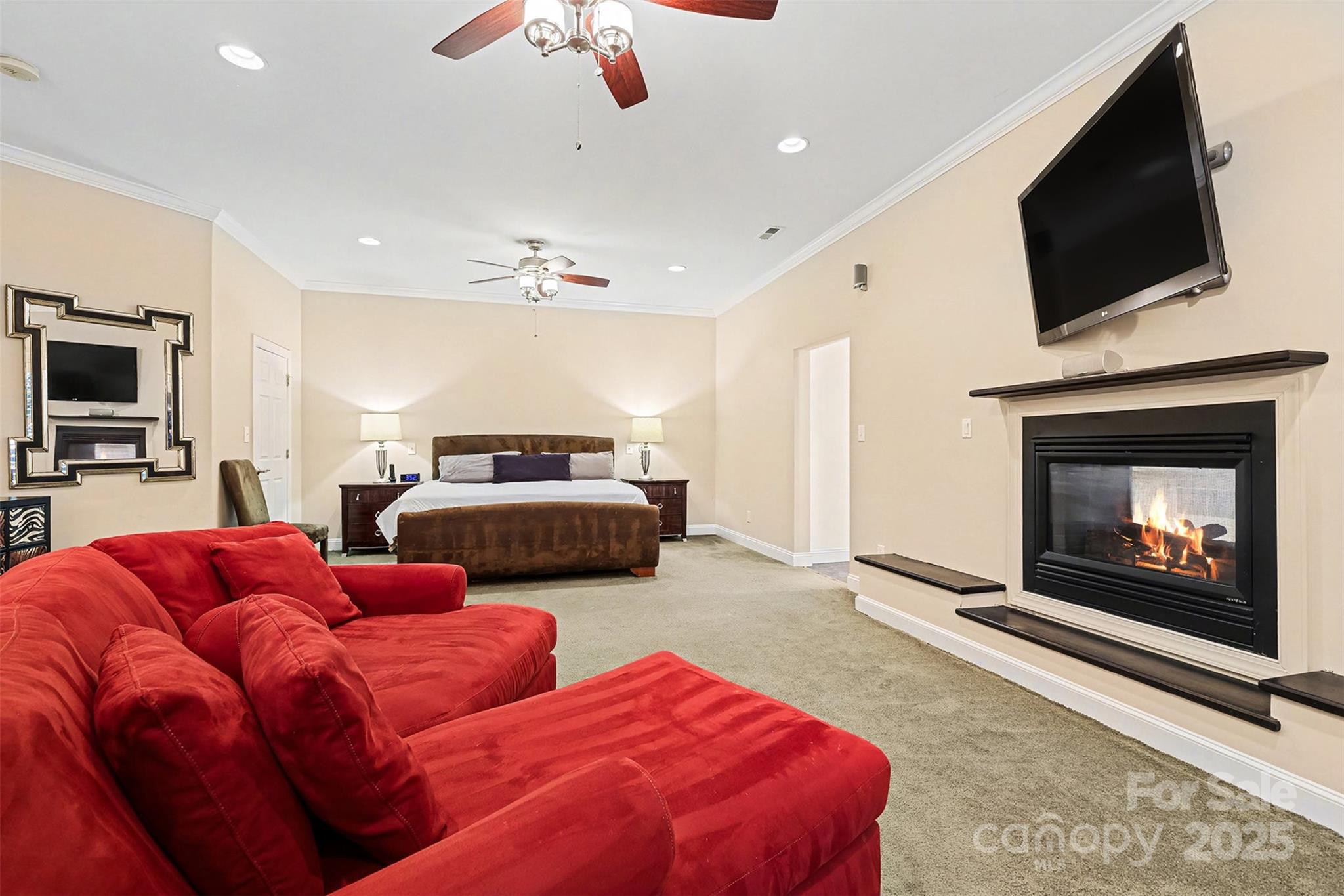 5418 Commodore Place Clover, SC 29710 - Photo 20 of 48 a bedroom with a bed and a flat screen tv