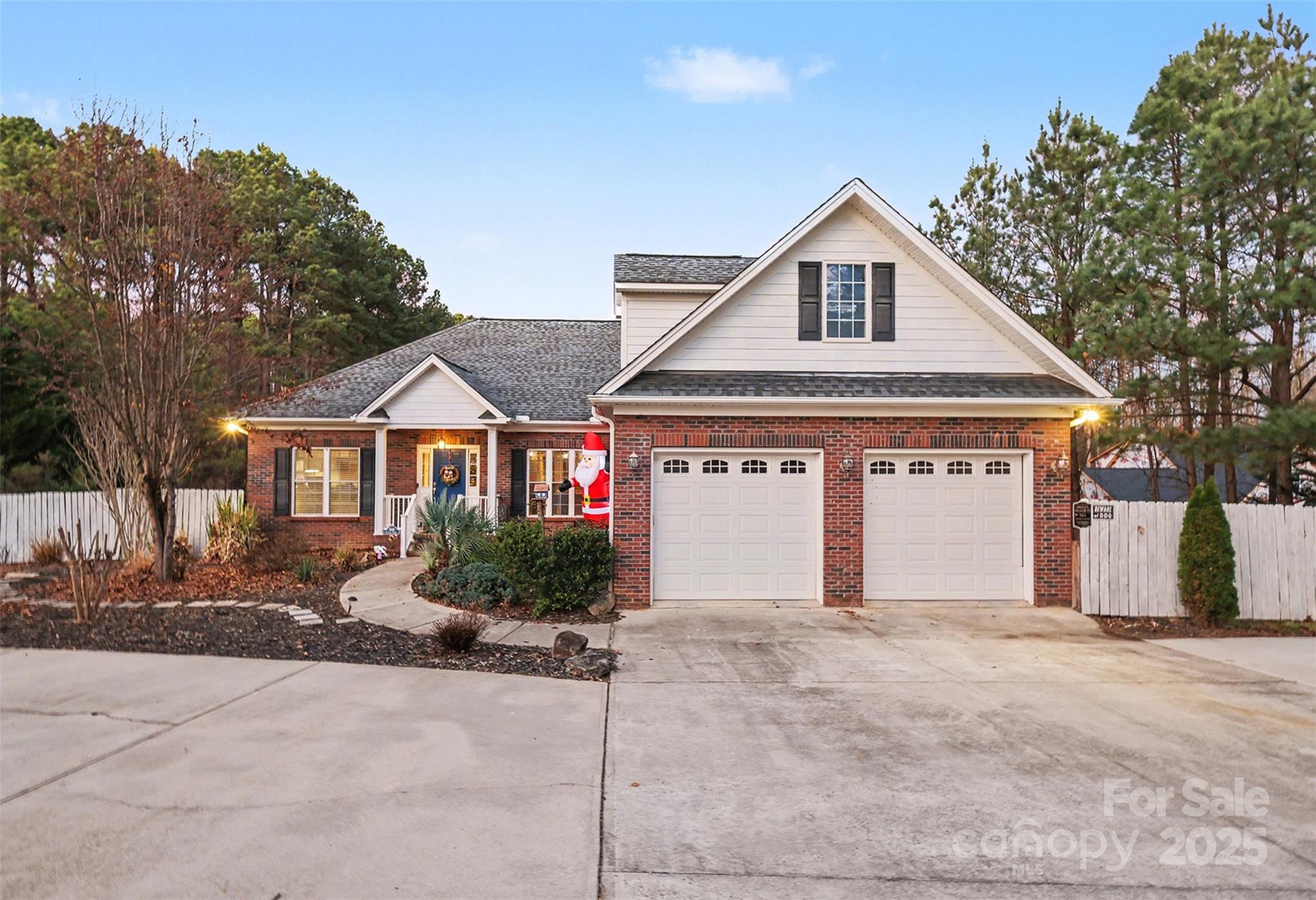 5418 Commodore Place Clover, SC 29710 - Photo 2 of 48 a front view of a house with a yard and garage