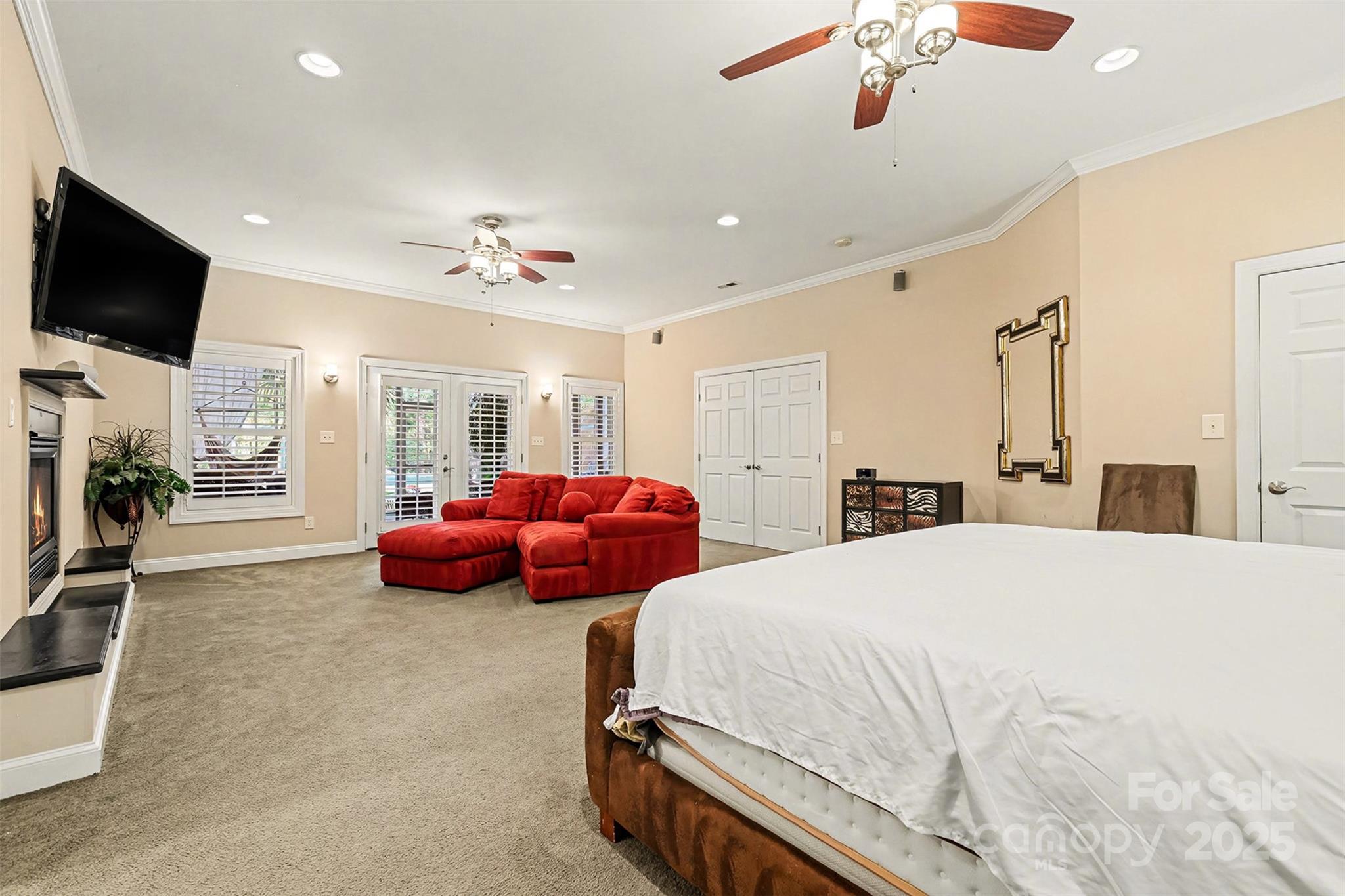 5418 Commodore Place Clover, SC 29710 - Photo 22 of 48 a spacious bedroom with a bed and a flat screen tv