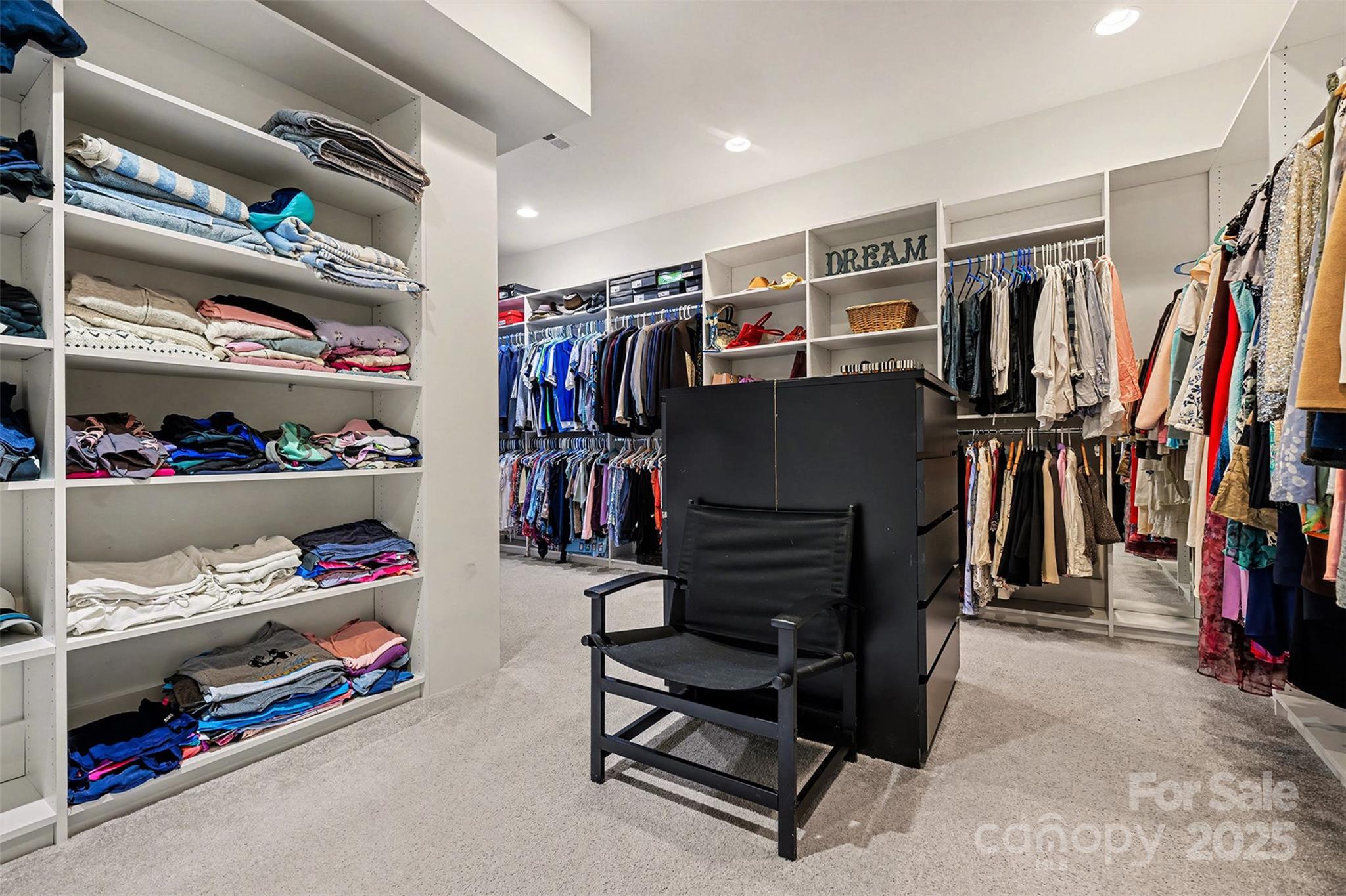 5418 Commodore Place Clover, SC 29710 - Photo 27 of 48 a view of walk in closet with clothes and shoes