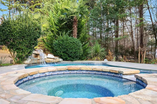 a view of a swimming pool with an outdoor space