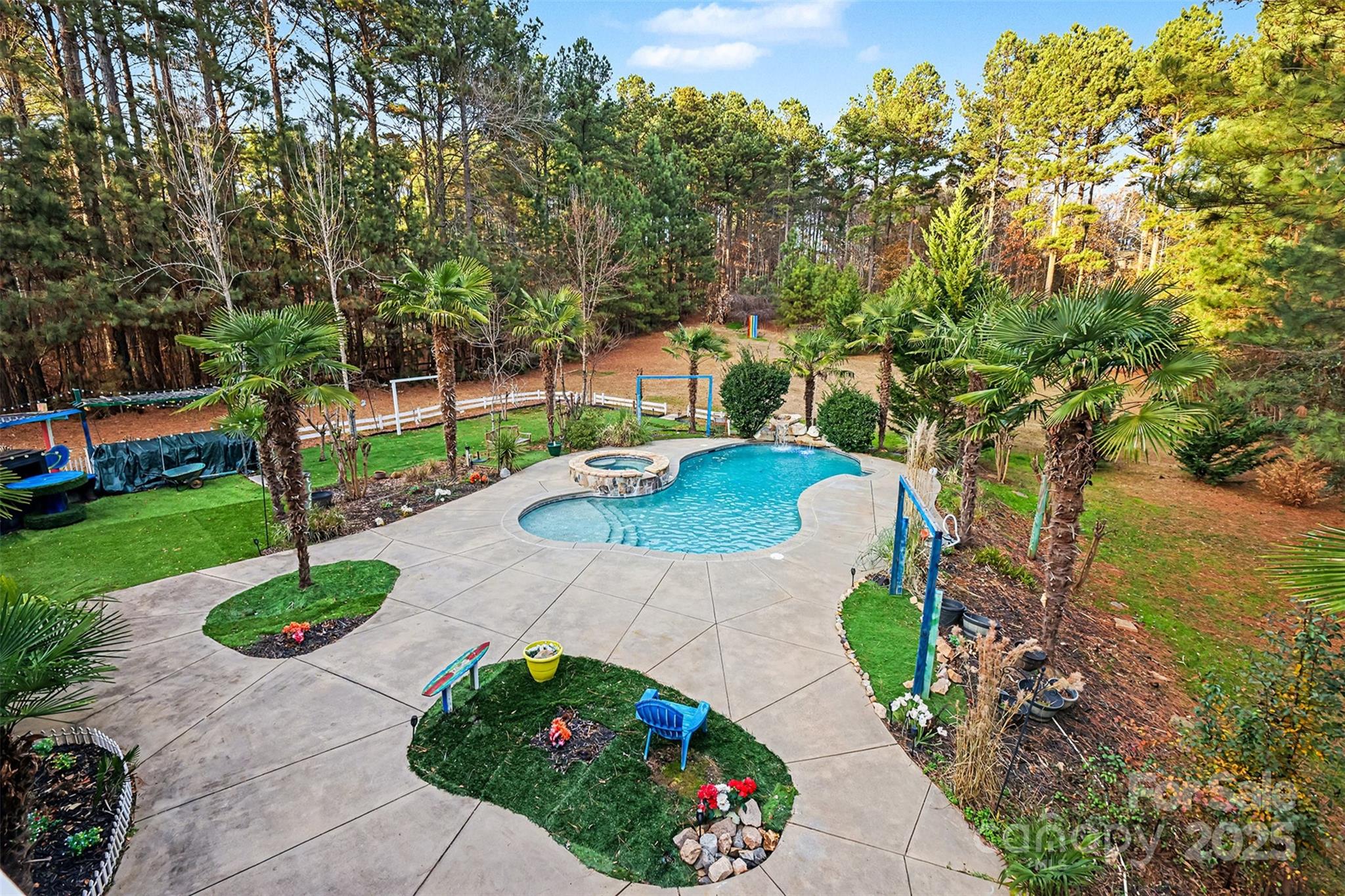 5418 Commodore Place Clover, SC 29710 - Photo 41 of 48 a view of a garden with a fountain in front of the house