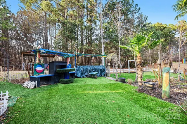 a childrens park with lots of swings and slides