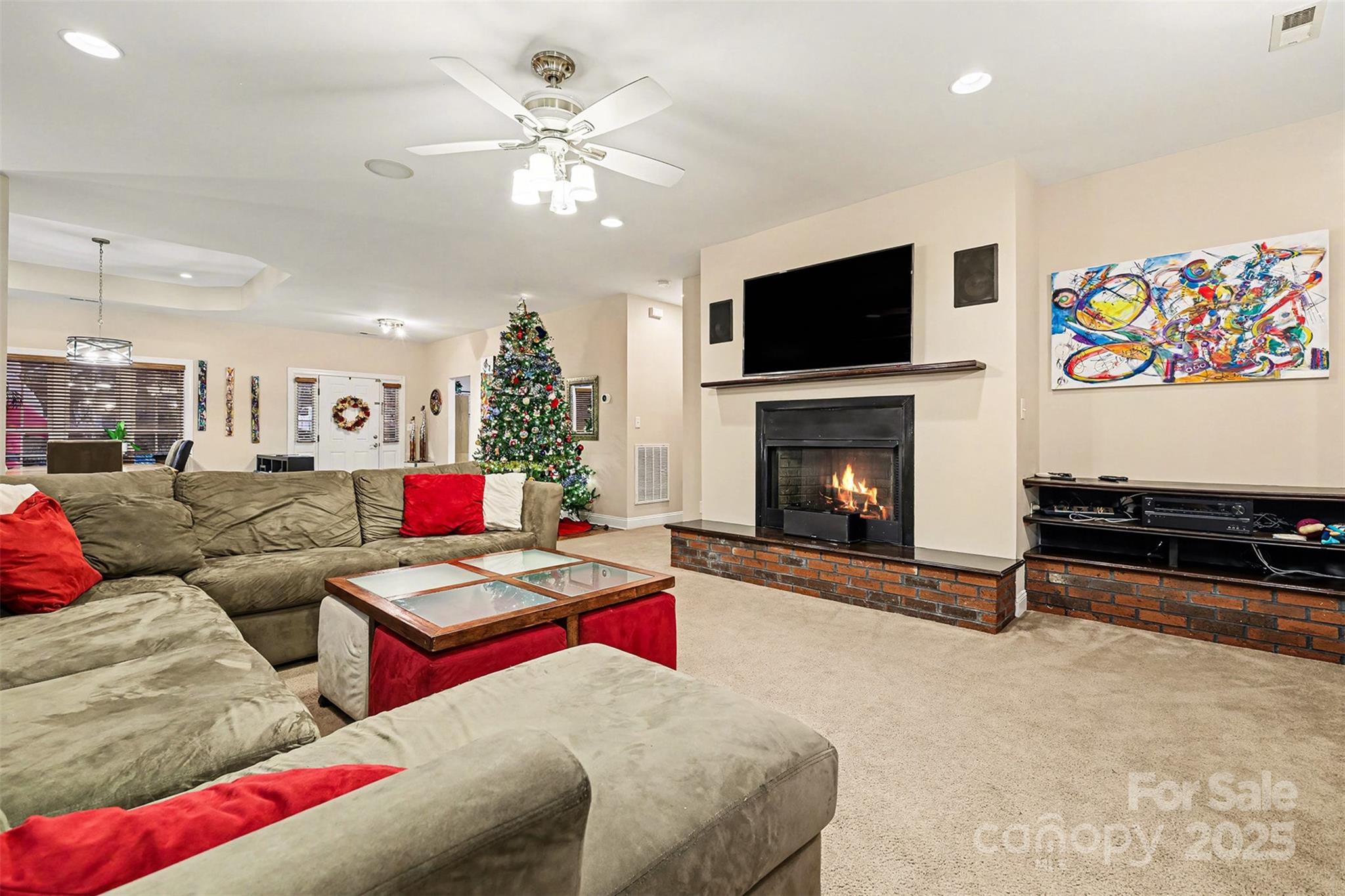 5418 Commodore Place Clover, SC 29710 - Photo 6 of 48 a living room with furniture a flat screen tv and a fireplace
