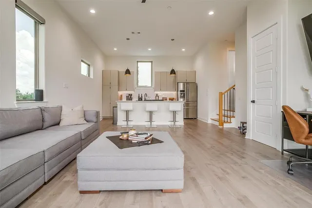 a living room with furniture and a large window