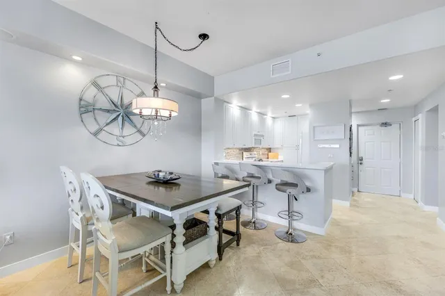 a kitchen with a table and chairs in it