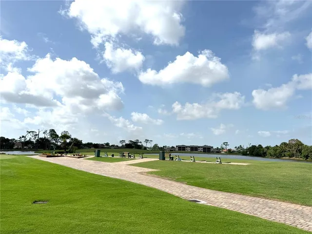 a view of a golf course with a lake