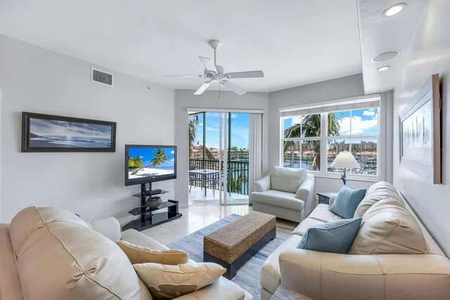 a kitchen with kitchen island a stove a table and chairs in it
