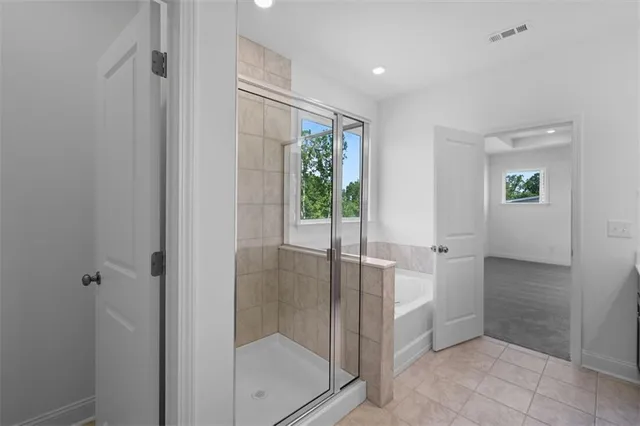 a bathroom with a shower and a sink