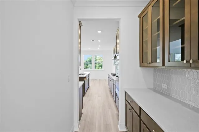 a view of a kitchen with a sink and cabinets