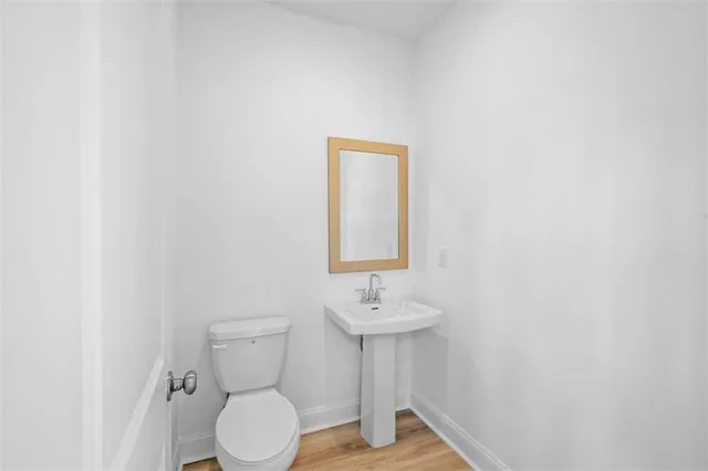 a bathroom with a toilet sink