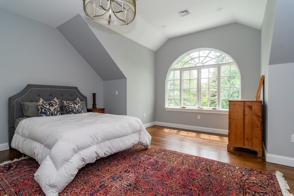 1098 Webster Street Needham, MA 02492 - Photo 15 of 21 a spacious bedroom with a bed and a large window