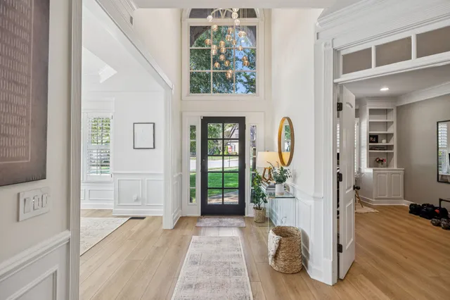 a living room with furniture or stairs and a wooden floor