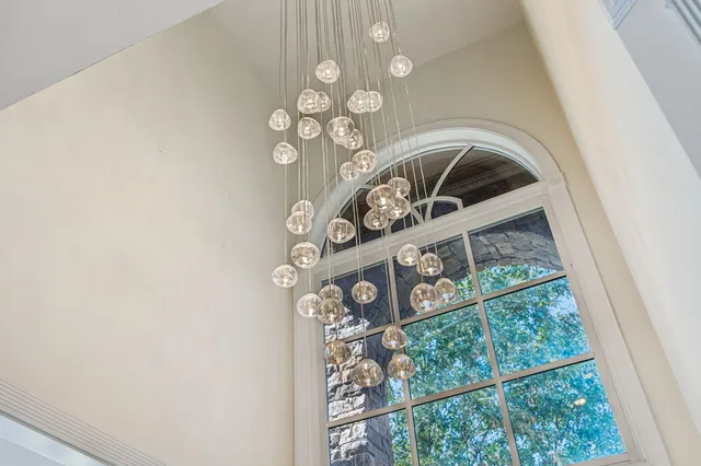 a living room with furniture kitchen view and a dining table